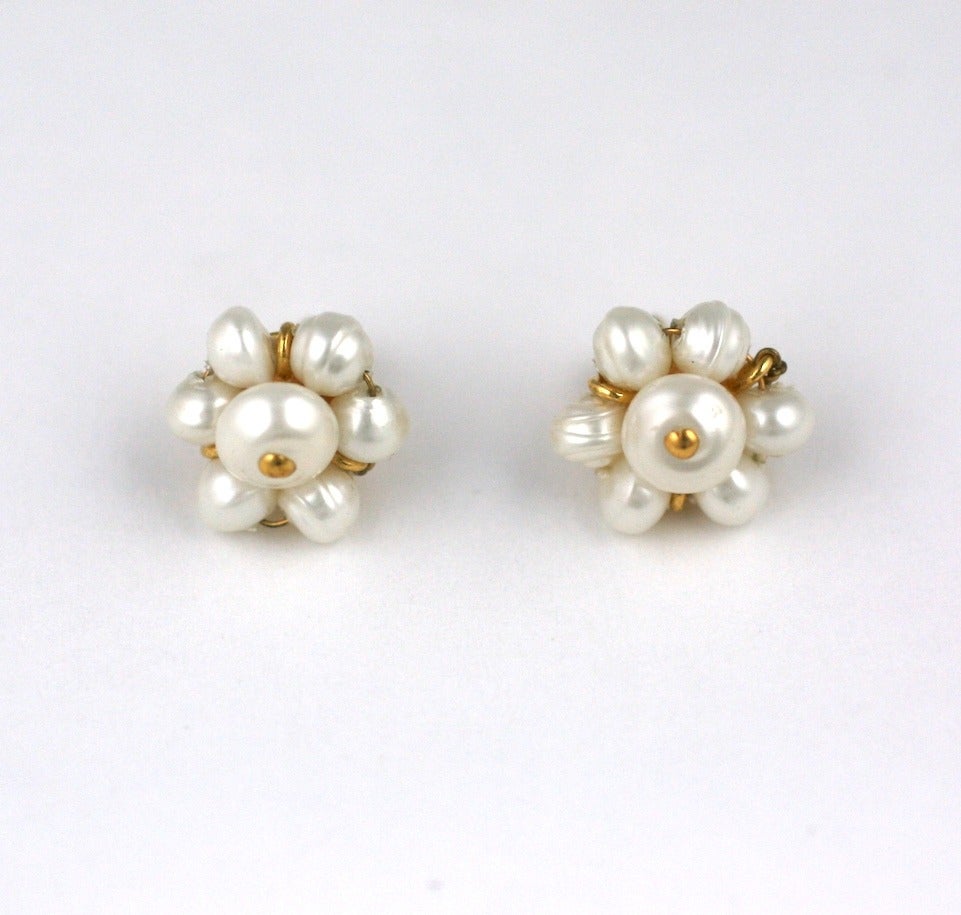 Chanel Pearl stud earrings with gilt spacers. The tiniest, cutest earrings we've ever seen from Chanel made with baroque faux pearls and stud fittings. Great everyday earring. Signed 