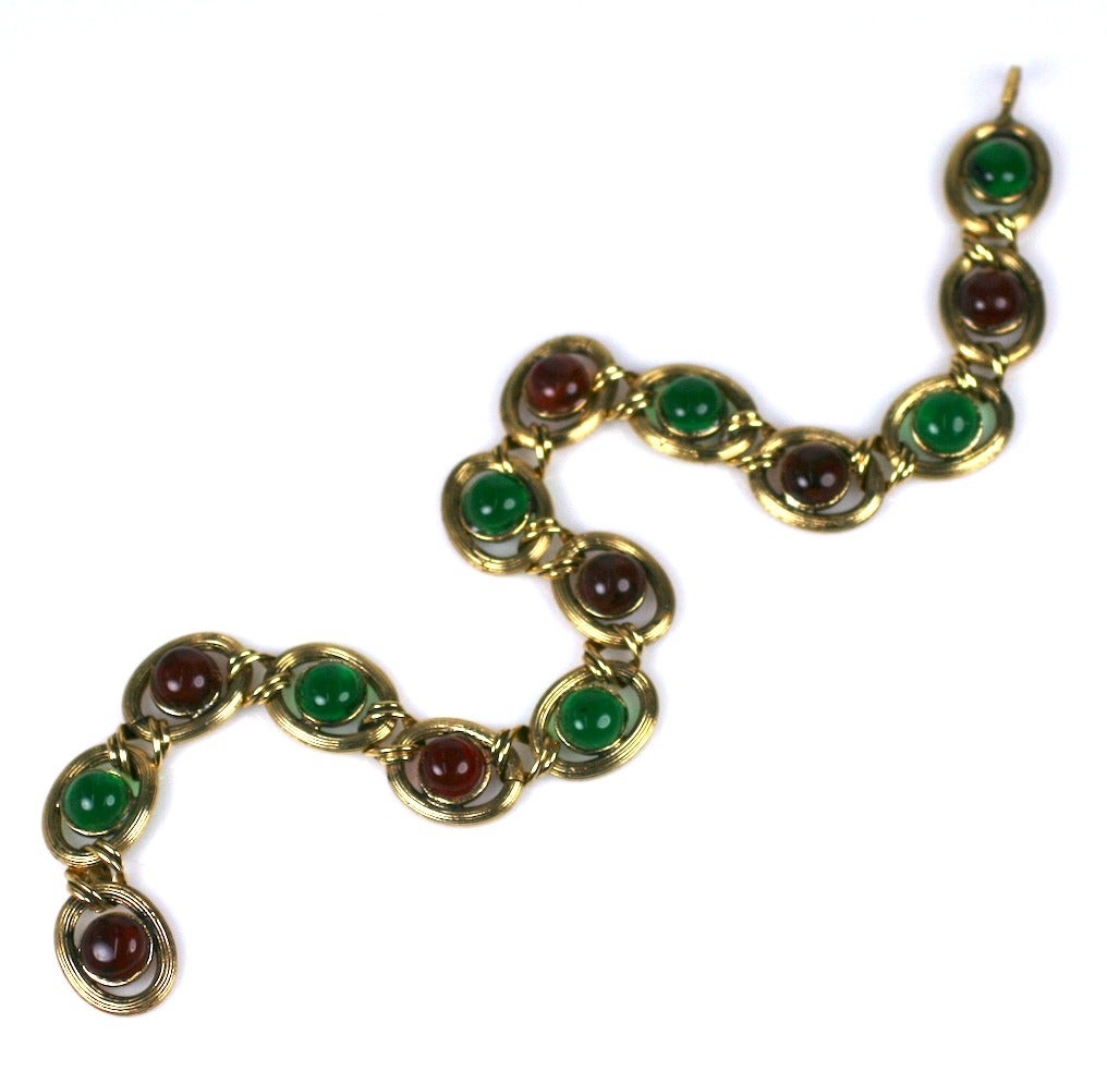 Maison Gripoix for Chanel Medieval amythest, ruby and emerald poured glass enamel chain necklace. The incised oval links centered with alternating poured glass Gripoix cabochons.
Hook closure, Signed Chanel.
Excellent Condition,
Length 17