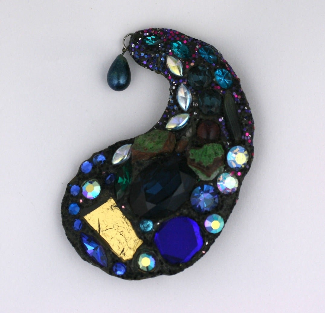 Andrew Logan brooch from the early 1980's UK. One of the English Eccentrics, Logan created his own world with shards of broken mirrors, stones and glitter and collaborated with other designers as Zandra Rhodes.  
Signed 1984 