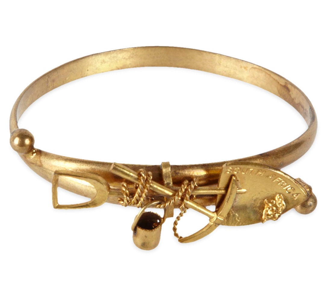 Unusual Victorian bangle commemorating the South African Gold Industry. Crossover style with mining motifs. Large size. 1890's.
Excellent condition