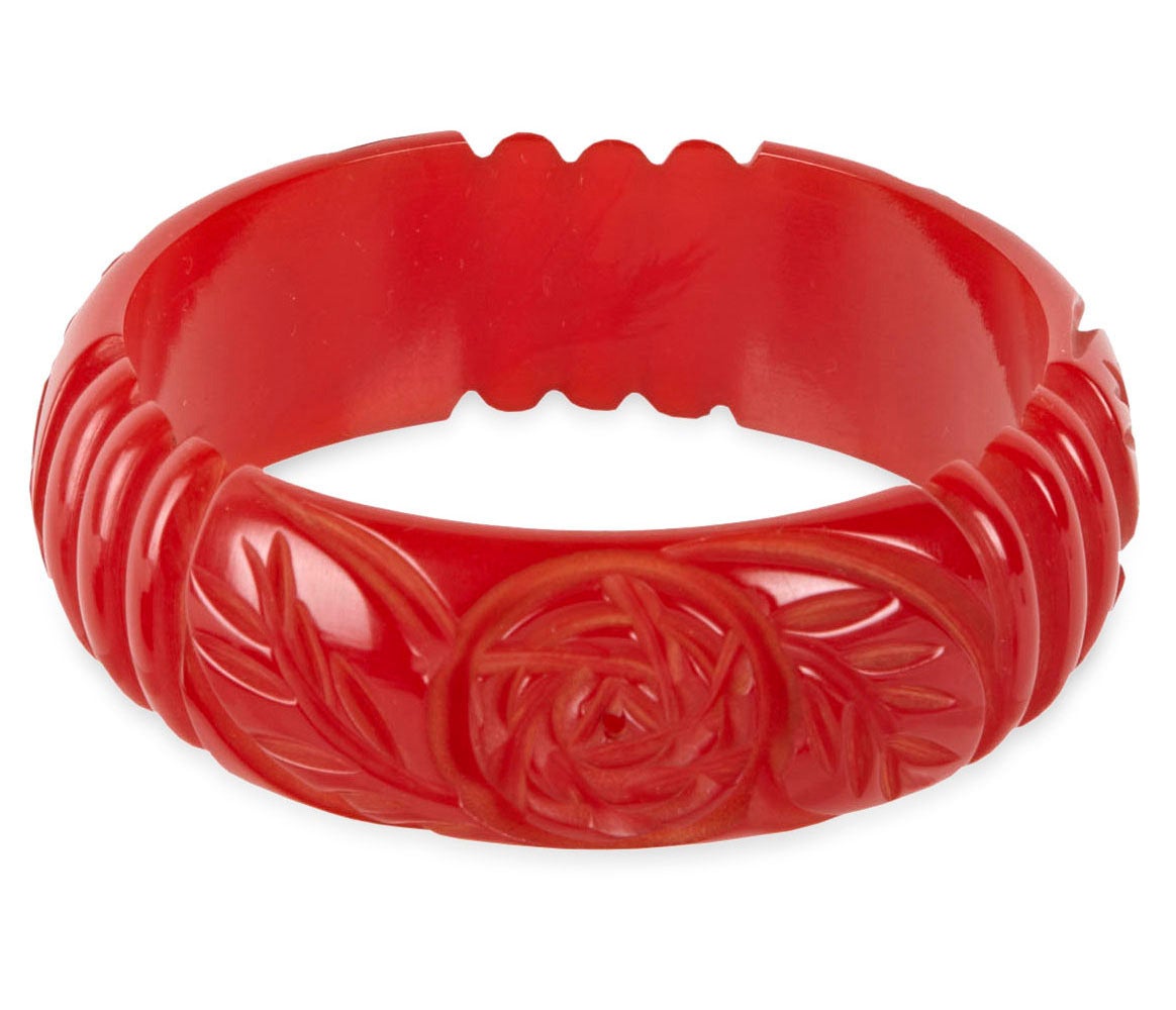 Vibrant Carved Red Bakelite Bangle from the Art Deco period with carved roses and striations. 1930's USA. 1