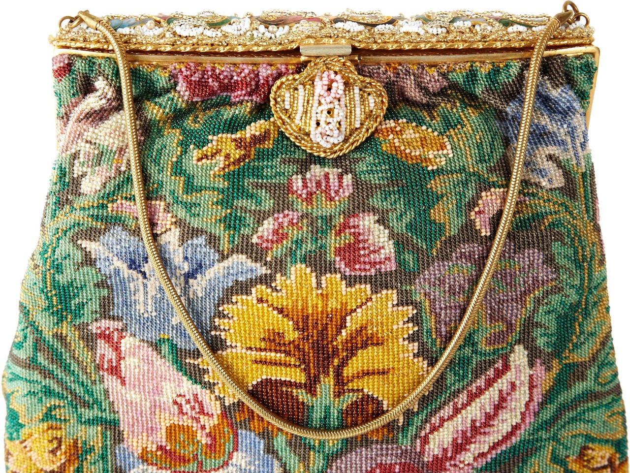 Victorian Micro Bead Floral Bag, Lined in peach satin with matching enamel plaques and seed pearl frame in milk, gold and pearl seed beads. Original micro bead floral bag body made circa 1890 with a attractive frame remount circa 1950.
9