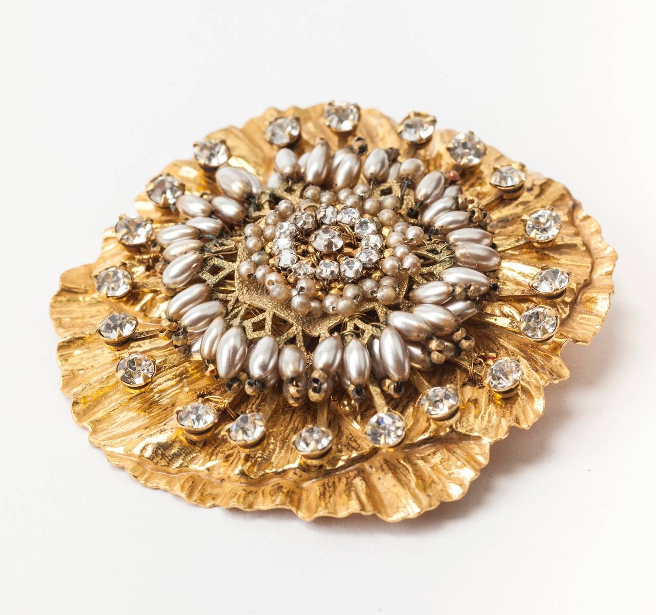 Miriam Haskell's elaborate and massive three-dimensional poppy flower brooch of crystal rose montees, diamonte and faux round and rice pearls in signature Russian gilt.
1950's USA. 
Excellent condition.
L 2.75
W 2.50