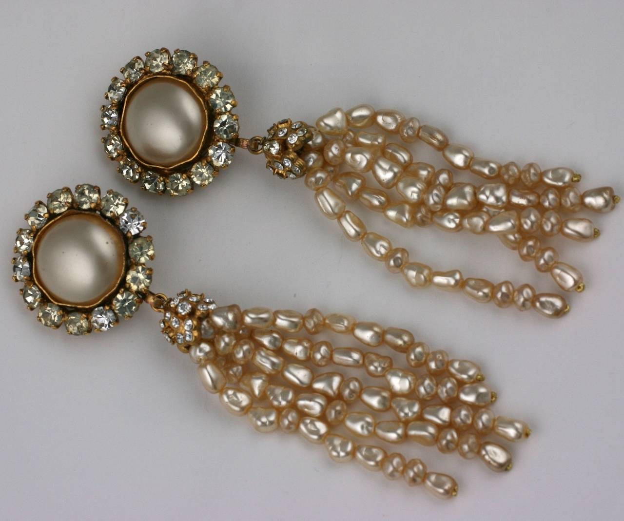 Chanel Large Pearl Tassel Earrings by Maison Gripoix. Clip back fittings with large faux mabe pearls and baroque pearl tassels. Paste caps and surrounds.
Large and imposing scale. 1990's France. 5