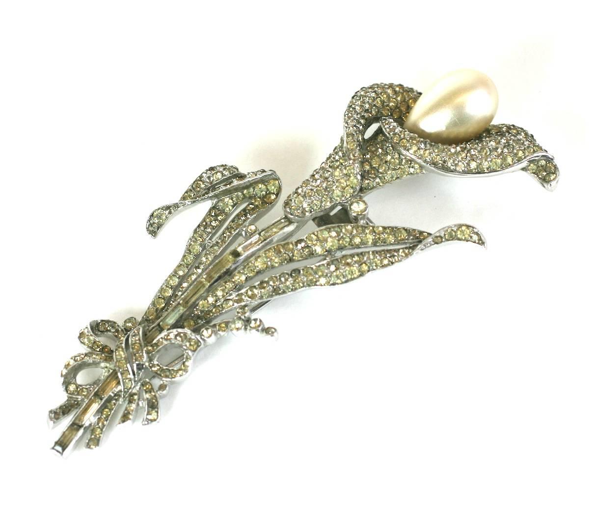 Trifari Calla Lily Brooch of fine crystal pave, large faux pear shaped pearl and vari size rectangular baguettes with intricate pave work. Designed by Alfred Philippe for Trifari. Double clip back fitting. 1930's USA. Excellent condition. Length 4