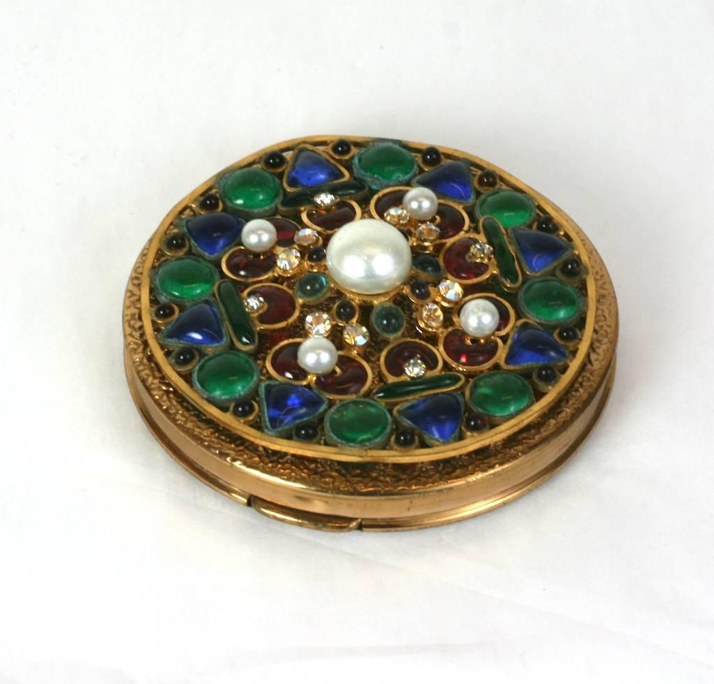 Maison Gripoix  decorated compact  in the byzantine taste. Gilt metal, faux pearls with ruby, emerald and sapphire poured glass enamel, further embellished with crystal pastes. Handmade in France, 1950's. Excellent condition. 3