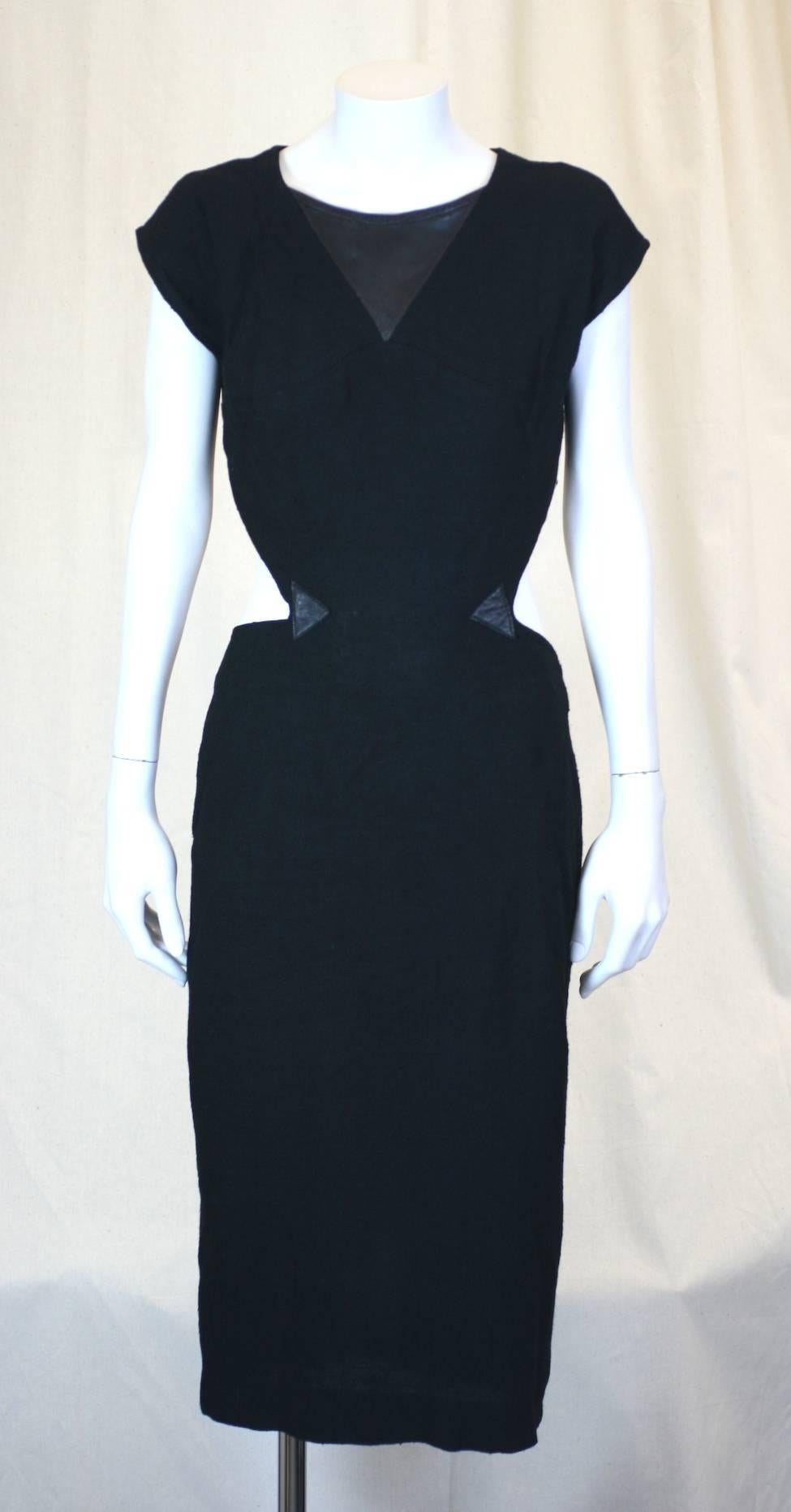 Deceptively sexy Black Linen and Leather Cutaway Buckle Dress, Malbruno, Paris. 
Demure front has a cutaways extending from rear which are reinforced with leather triangles. 
There are bondage style leather trimmed buckles at the neck, back and