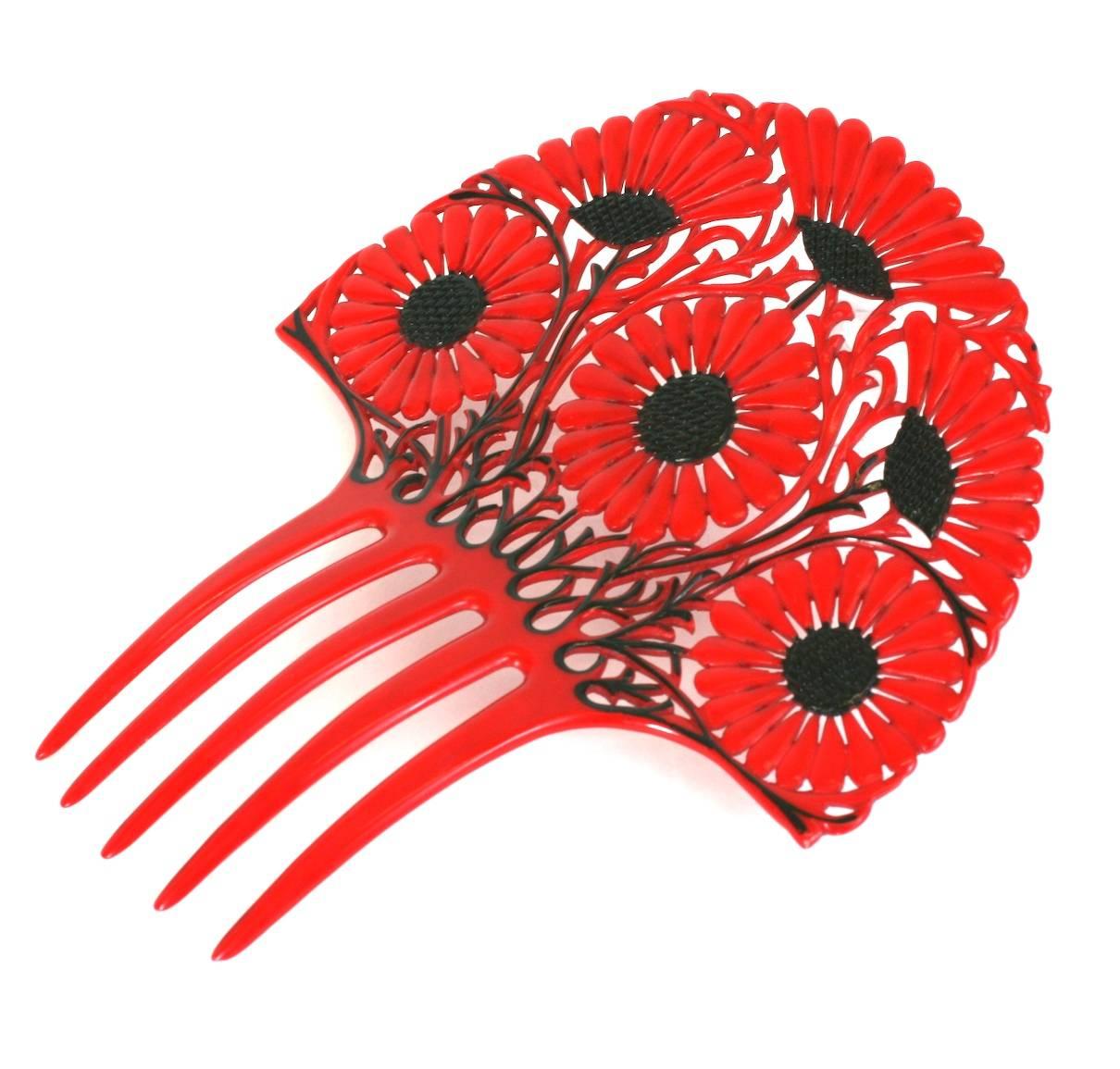 Art Deco French Celluloid Marguerite Hair Comb in red with black overpaint detailing. Strong Art Nouveau flavor in wonderful vibrant tones. 1930's France.
Excellent condition.