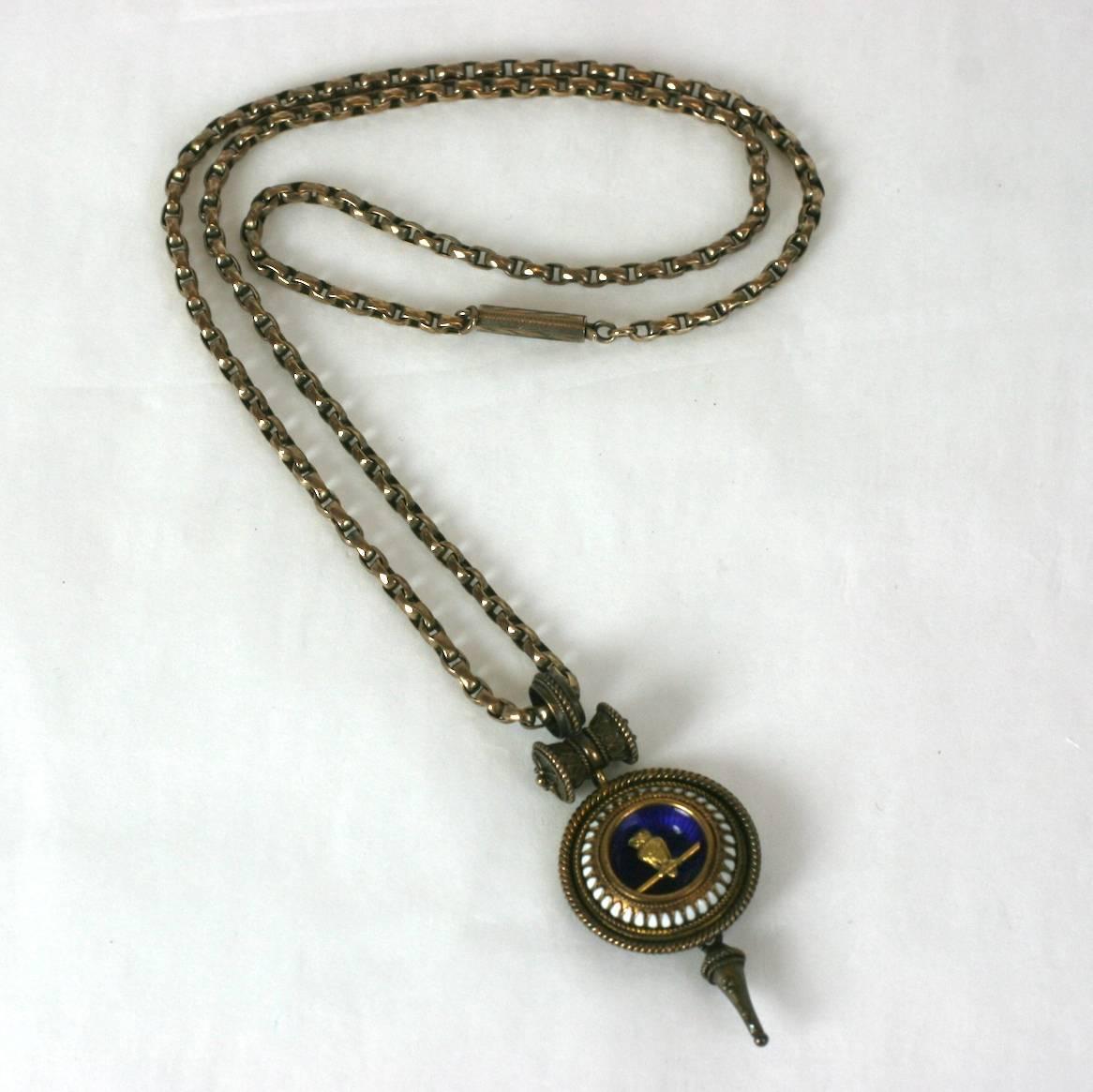 Charming Victorian Revivalist Owl Necklace from the late 19th Century. Charming owl motif which signified knowledge and wisdom, rendered as a beautifully detailed gold bird on branch within a blue enameled cup, bordered with white enamel and