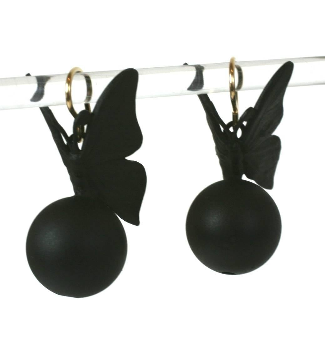 Matte Black Butterflies resting on spheres, based on antique Victorian models with gilded ear wires, a goth reinterpretation of 19th Century prettiness. Made in France in the Parisian studios of MWLC. 21st Century. 
1.5