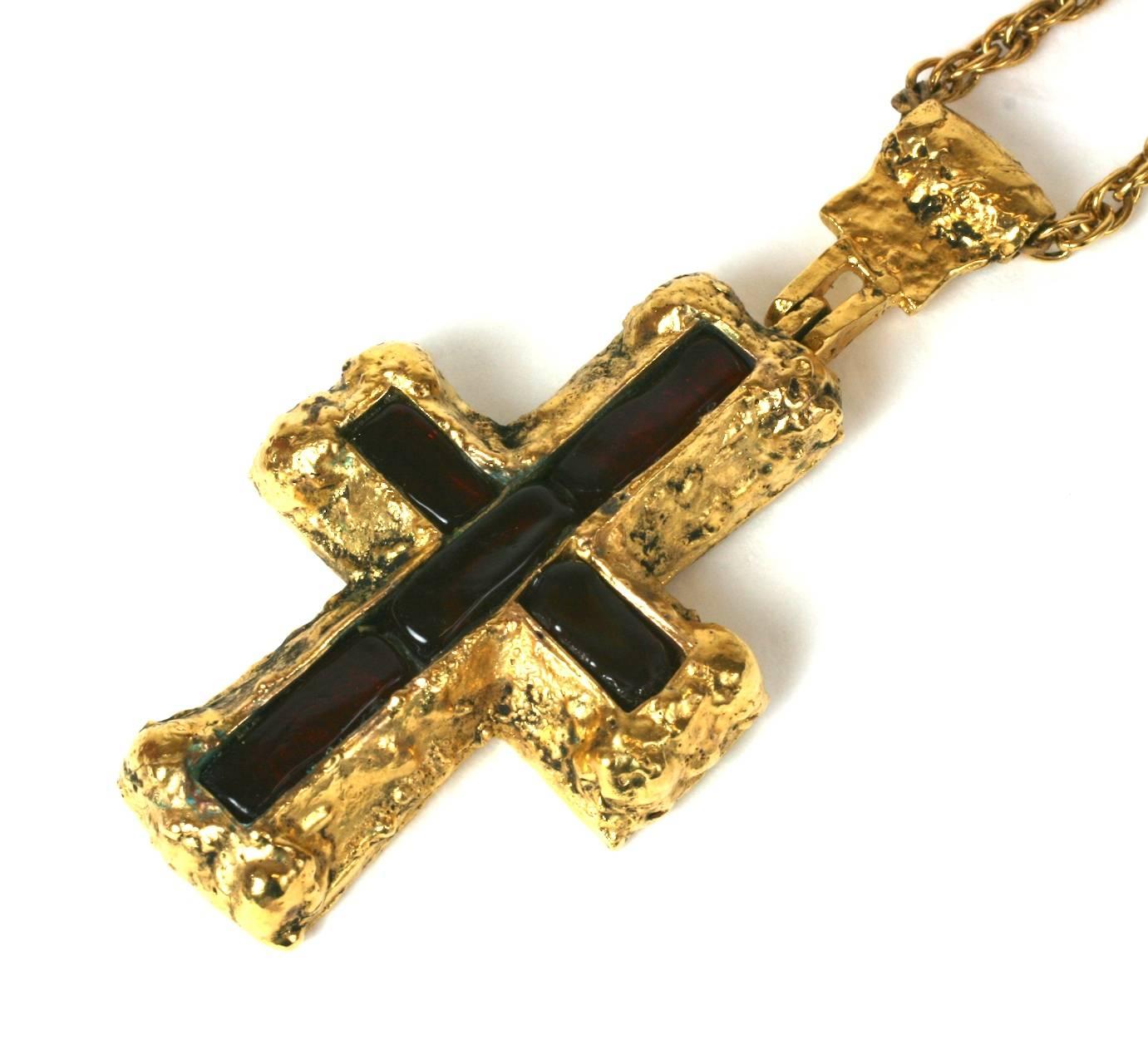 Chanel Byzantine Cruciform  pendant of rough Martelé gilt bronze with five large hand made garnet-ruby pate de verre baguettes. Handmade by Robert Goossens for Chanel. 
According to family tradition this crucifix necklace was a personal gift of