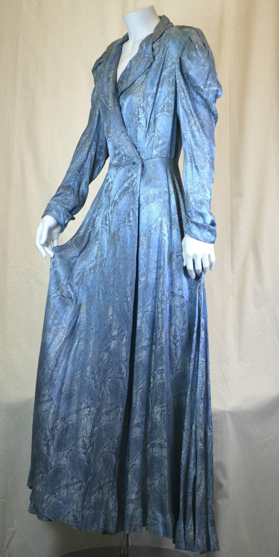 Art Deco Silver and Blue Lame Wrap Gown, originally destined for the boudoir, but, works wonderfully as an evening coat. Made from silky metallic French lame, this Hollywood styled topper, has a beautiful silvery leaf pattern embedded onto an aqua