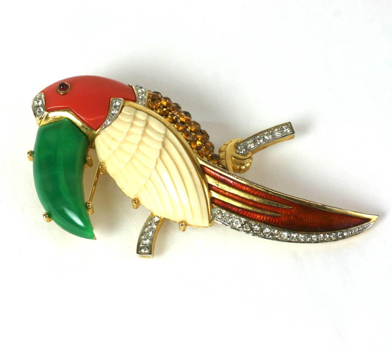 Charming Hattie Carnegie Toucan brooch made with molded resin to replicate coral, ivory and jade carvings. All these are offset with pave rhinestone work in crystal and citrine on the belly. 1960's USA. 3.25