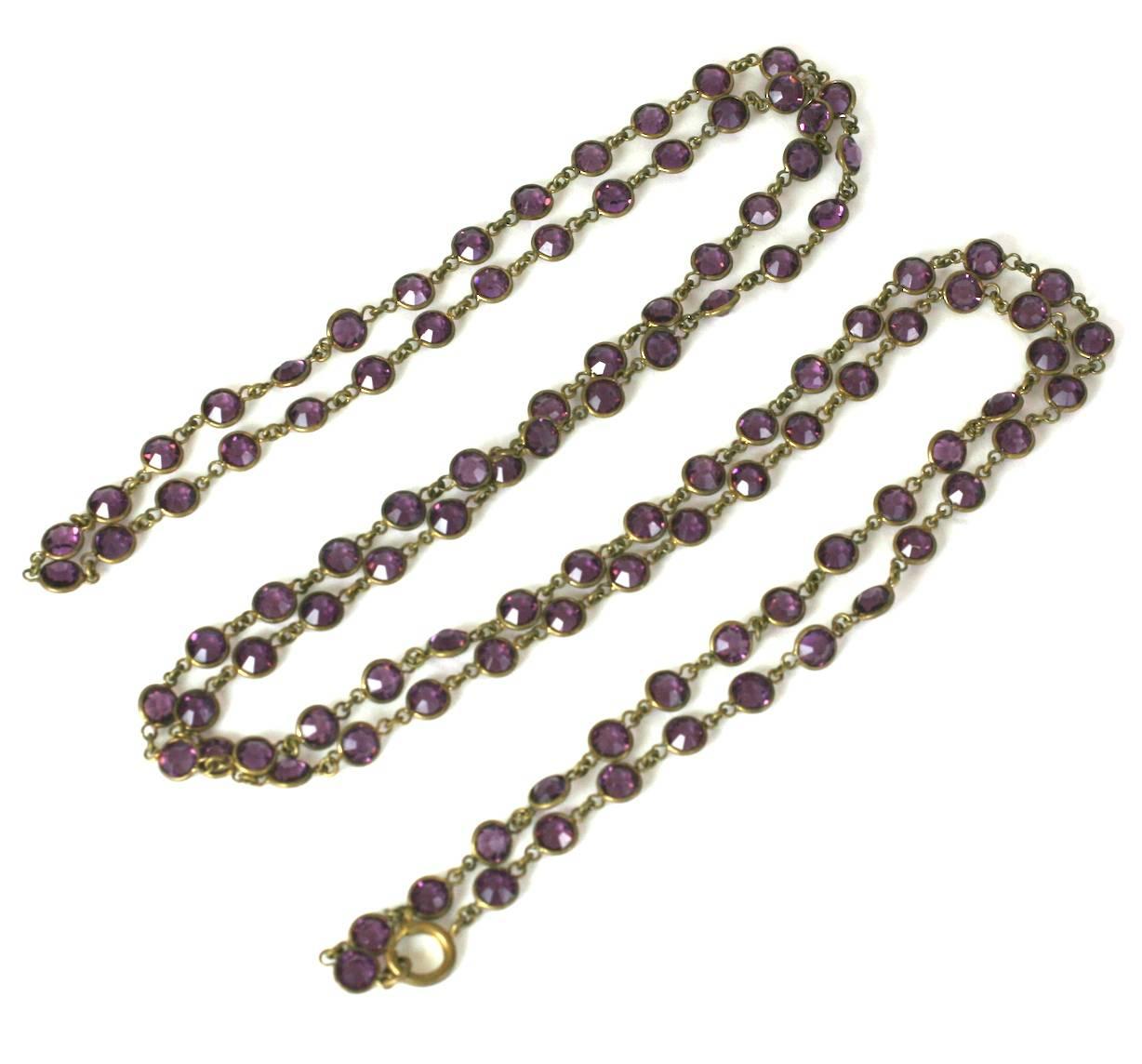 Art Deco Amythest Crystal Chain in super long length. Clasp allows chain to be wrapped multiple times or worn singley. Amythest glass crystals set in brass. 1920's USA. Excellent condition. 60