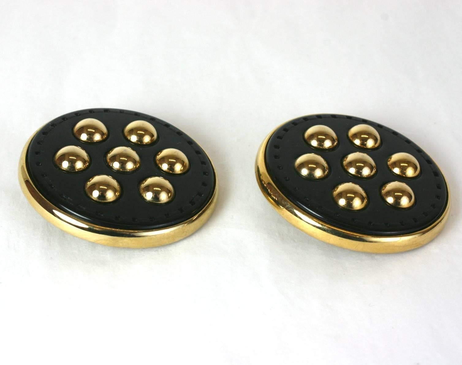 Massive Button Earrings from the 1980's. Large gilt discs are set with top stitched navy vinyl 