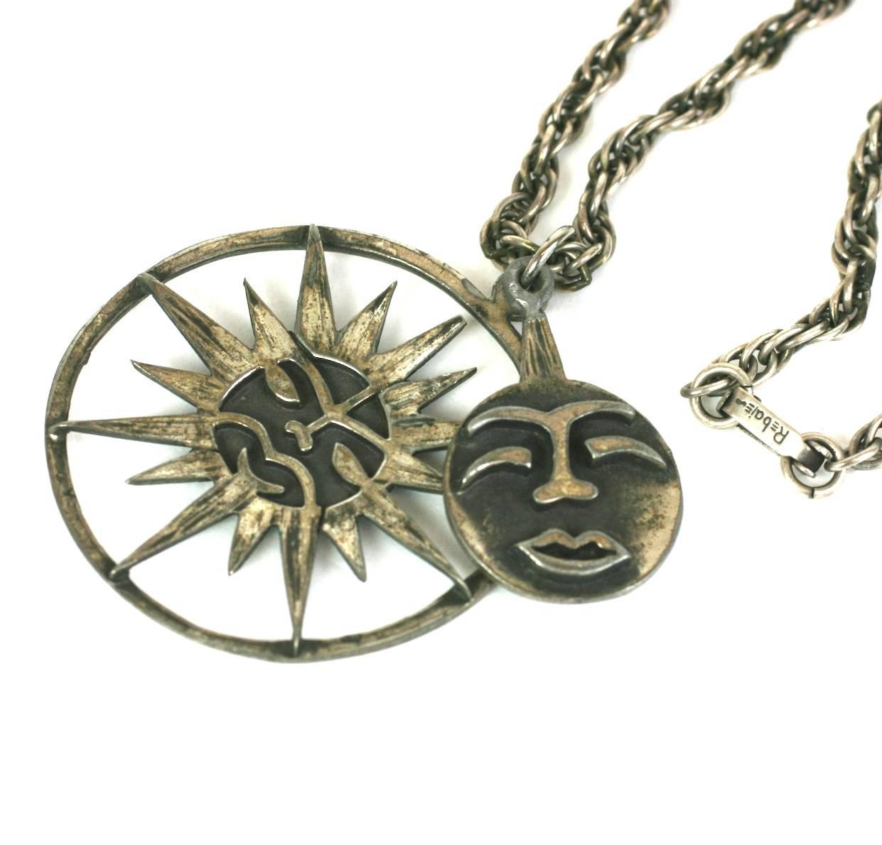 Charming and unusual Rebajes Sun-Moon Pendant in patinaed silver metal. A 