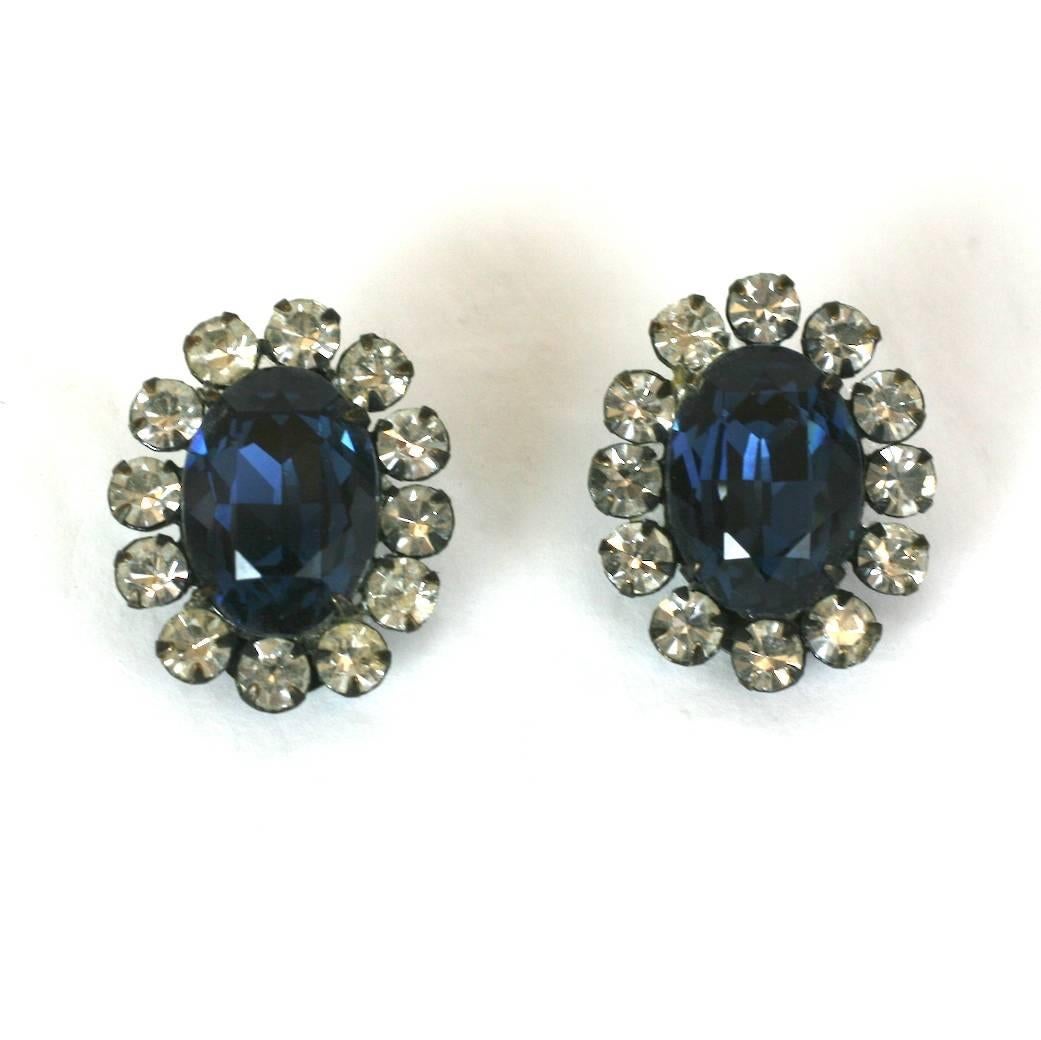 Schreiner faux sapphire and crystal pave oval ear clips from the estate of fashion icon D.D. Ryan. Excellent Condition. 1950's USA.
Length 1 1/16