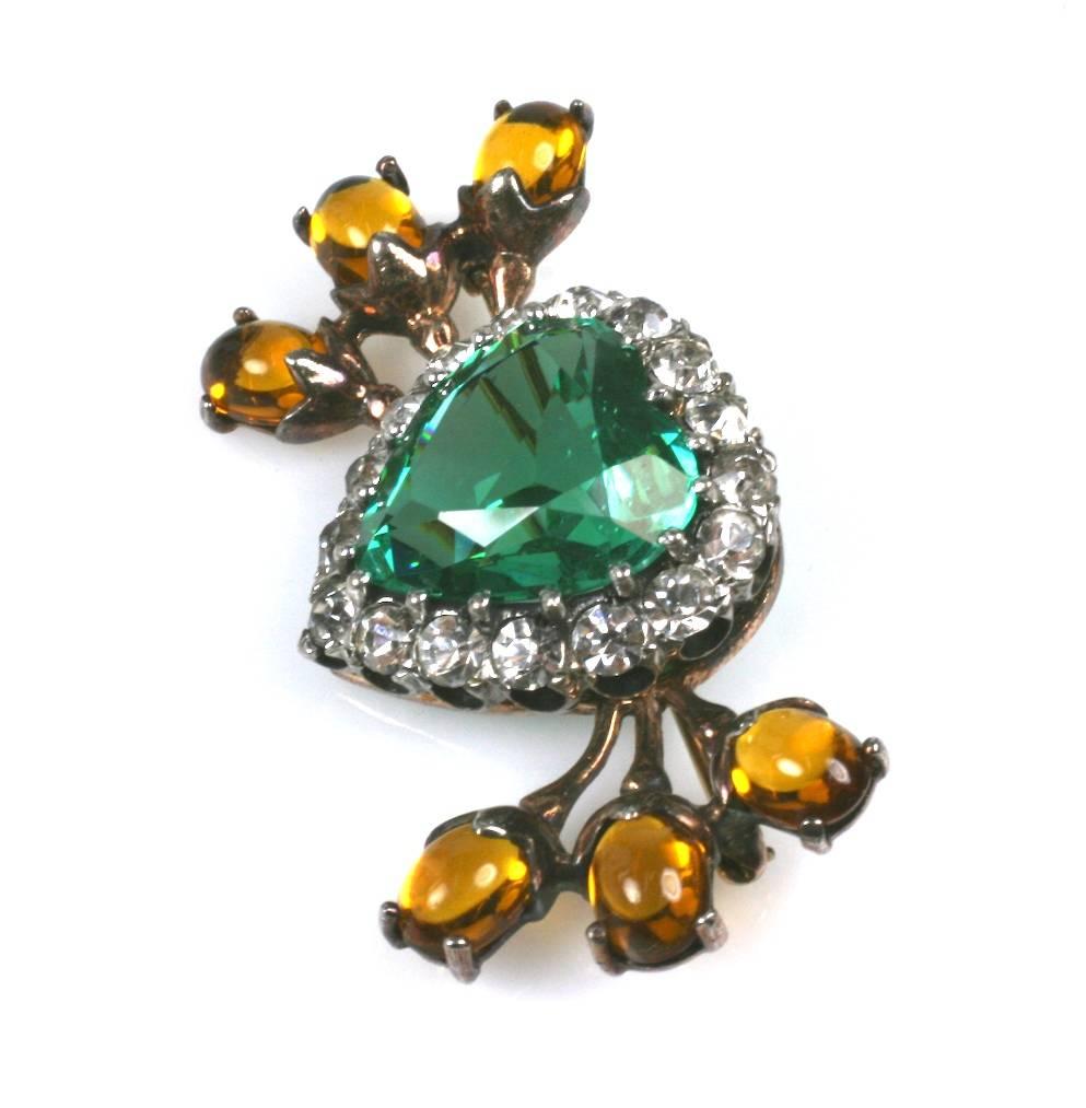 Lovely Retro sterling heart brooch with a gold wash likely made by Reja. Large green heart shaped paste is surrounded by crystal pastes and branches with faux citrine cabs. 1940's USA. Excellent condition. Lovely quality. 