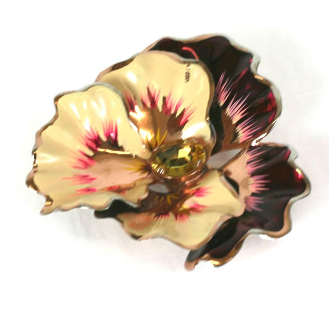 Art Deco Coro sterling pansy brooch with hand painted metallic and matte enamel highlights surrounding central citrine paste. Rose gold vermeil finish over sterling. 1930's USA.  Excellent condition.
2.5