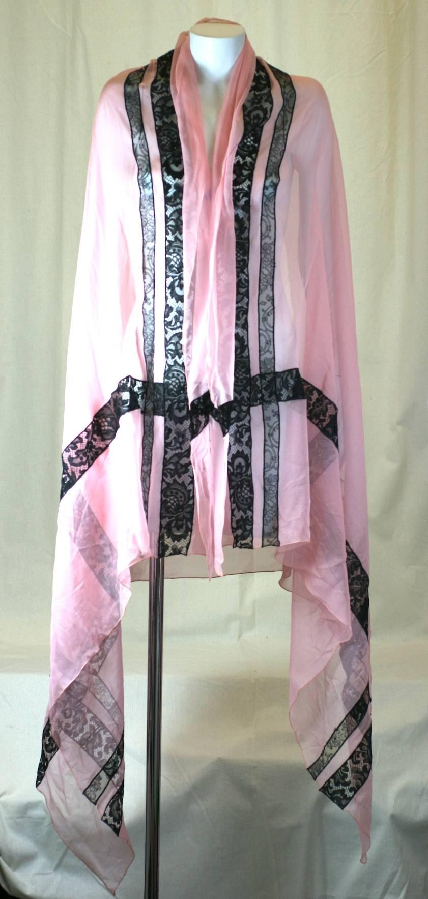 Givenchy Haute Couture Silk Chiffon and Lace Stole. Pink silk chiffon is inserted with strips of black lace in this large elegant wrap. 
1980's France. Unlabeled. Ex Collection NY Philanthropist Carroll Petrie. 
78