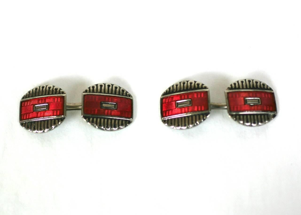 Attractive and unusual Art Deco back to back cuff links of rhodium plated metal with red transluscent hard enamel. 1920's USA. Excellent Condition. 
Length 13 mm, Width 11 mm. 