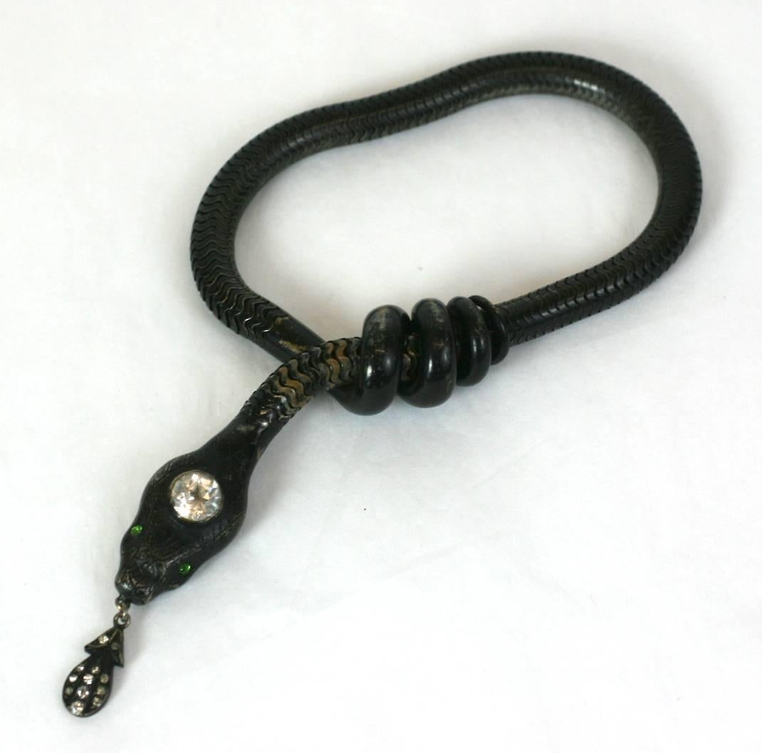 Super unusual, large blackened brass snake bracelet from the late 19th Century. 
We have handled these as necklaces and bracelets but always in a gilt finish with a jeweled drop. This one is very different, highly unusual and super cool.
This is