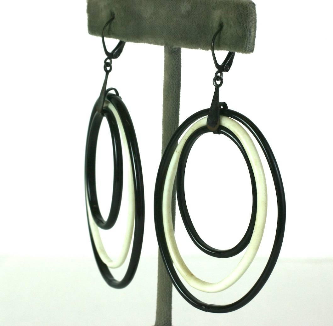 Delicate Edwardian lampwork glass, Secessionist style, long dangle earrings of 3 concentric black and white oval glass hoops. Delicate and handmade. 1900 Czech. Pierced fittings. Excellent Condition. 
Length 2.75
