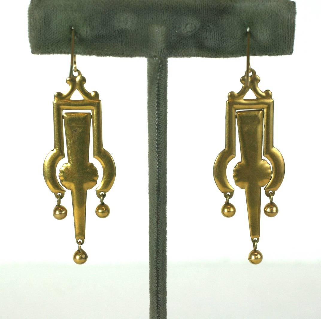 Victorian Articulated Enamel Drop Earrings set in gold filled metal with black floral tracery. Center pendant swings within its frame with 3 ball drops. 
1880's USA. 2