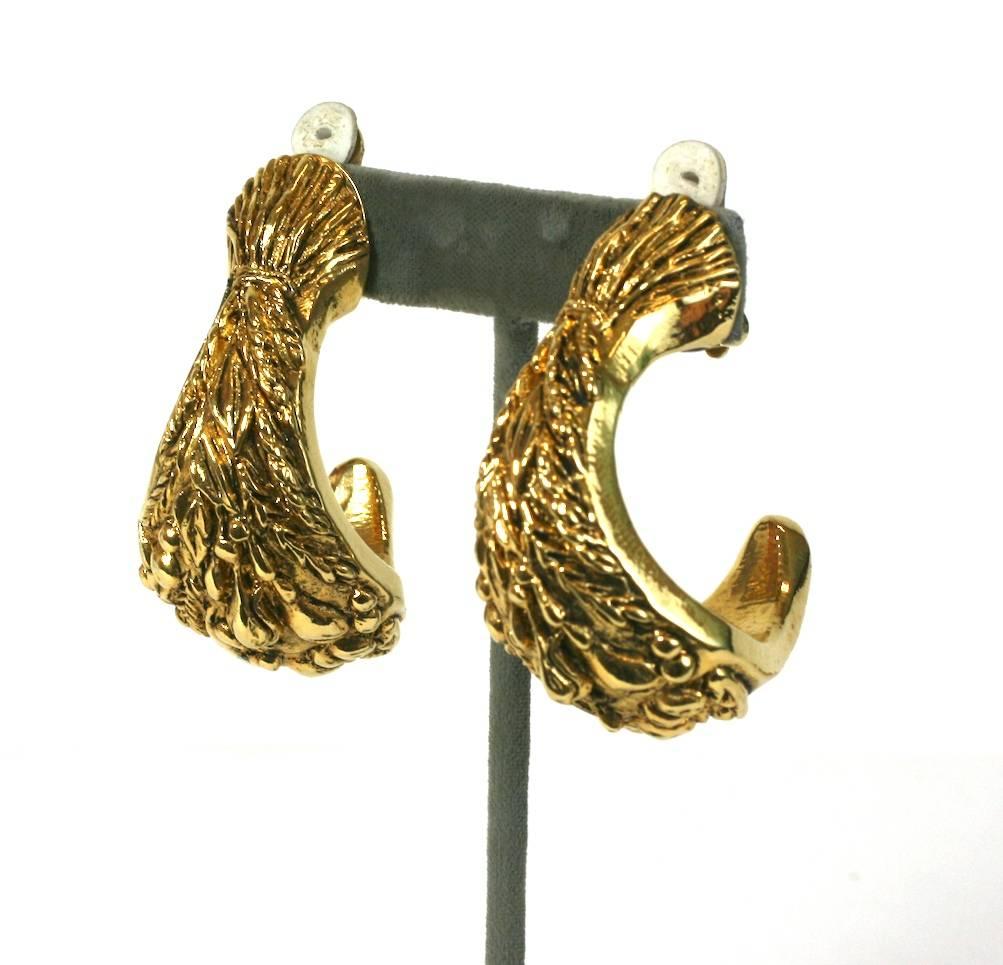 Imposing gilt French resin, carved and incised wheat sheave oversized hoop ear clips from the 1980's. Clip back fittings.  France 1980's.  Excellent Condition.  
Length 2 1/8