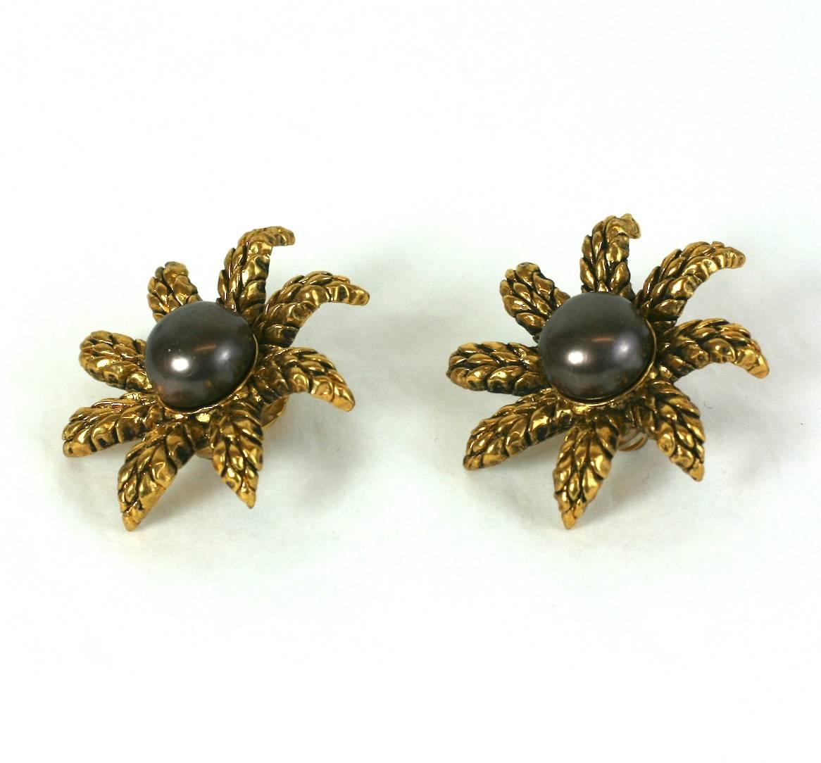 Chanel Star ear clips with wheat texture with a large handmade cocoa pearl by Maison Gripoix. France 1980's. 1.75