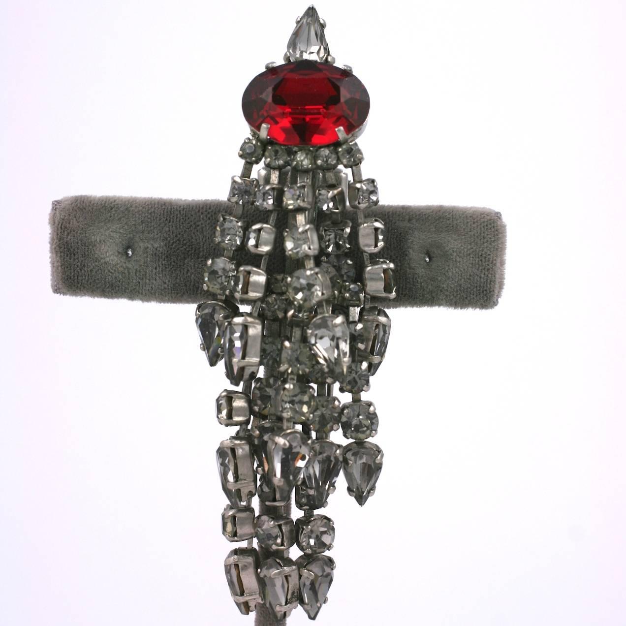Balenciaga tremblant Tassel Clip brooch of  prong set fringed gray crystal pastes with a large faux ruby focal stone, forming the tassels head.
Made in France, marked Depose. 1950's France. Excellent Condition
Length 3. 3/4