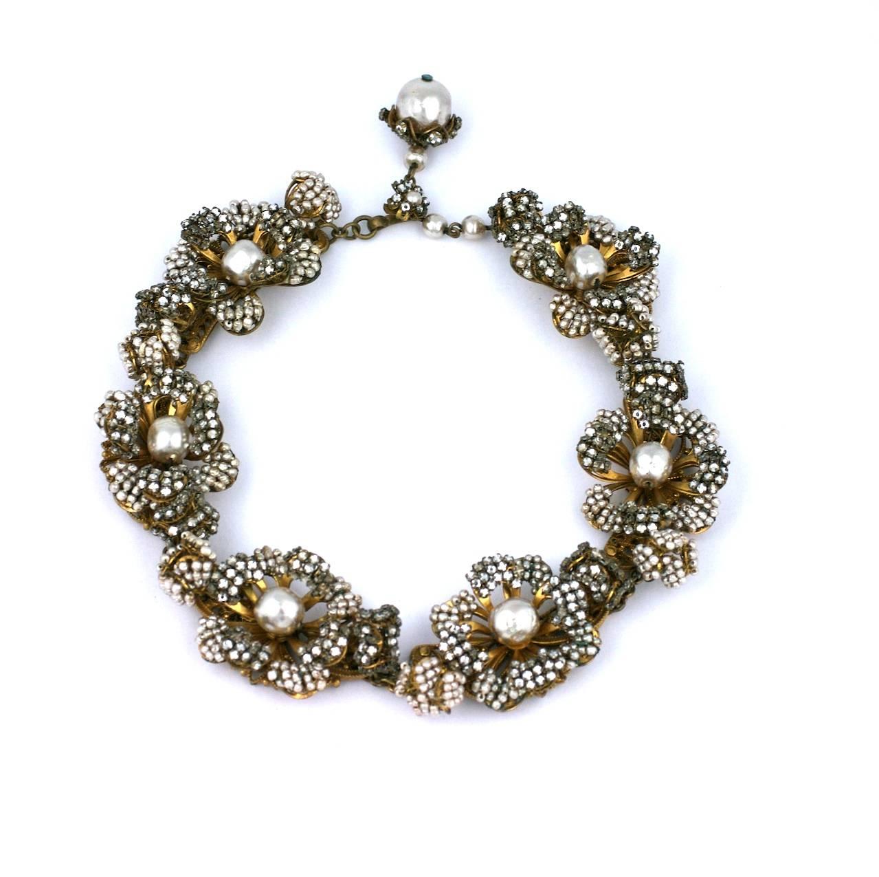 Collector quality Miriam Haskell Massive Rose Monte and Faux Pearl Flower Collar. 
The 3 dimensional flowerheads are completely hand embroidered with rose monte crystals and tiny faux pearl beads. Each flower has a closed bud on each side, one