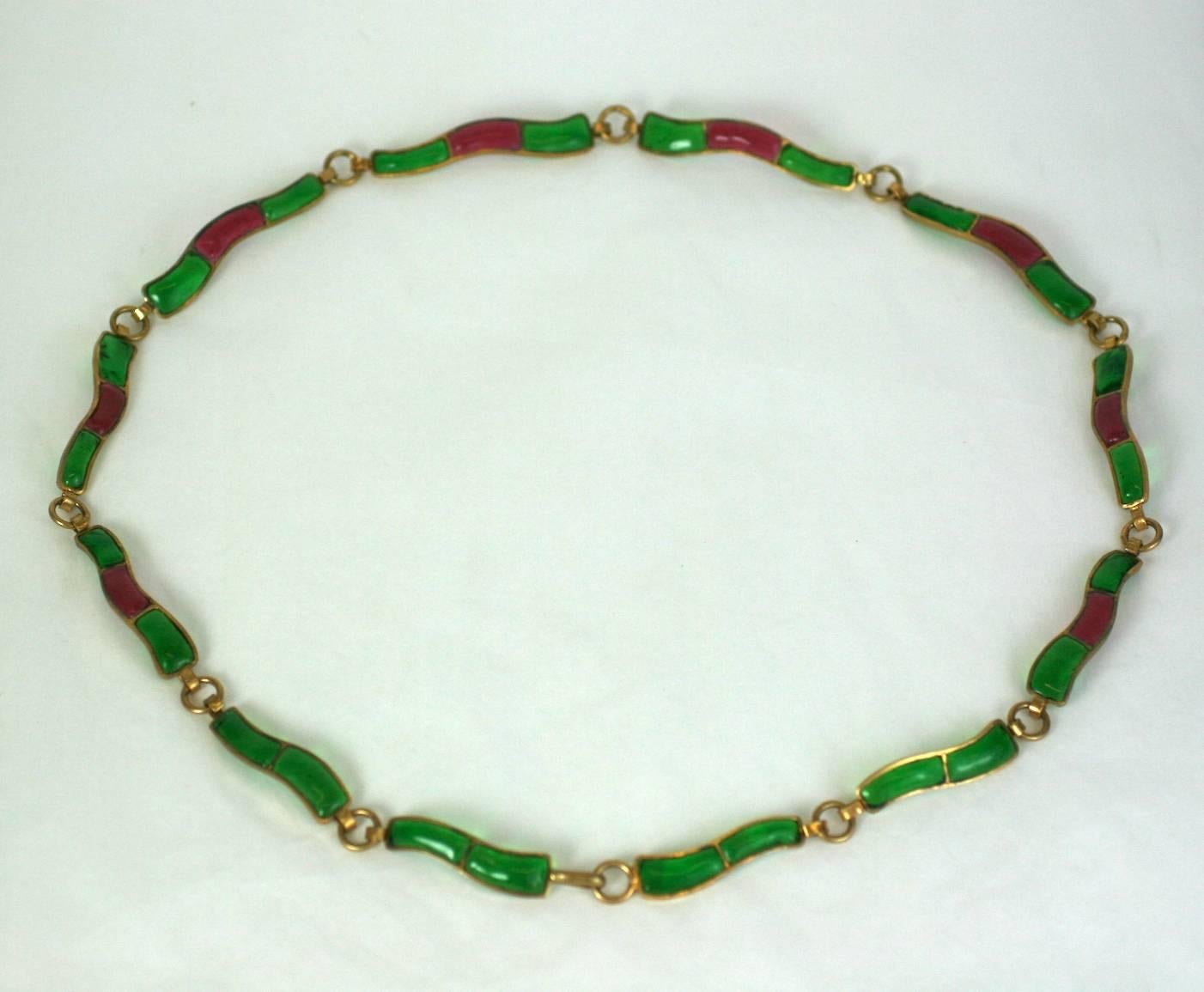 Coco Chanel segmented belt of poured glass elements in signature ruby and emerald pate de verre links. 1950's France, made by studio Gripoix. Unsigned.  Excellent Condition
Length 34