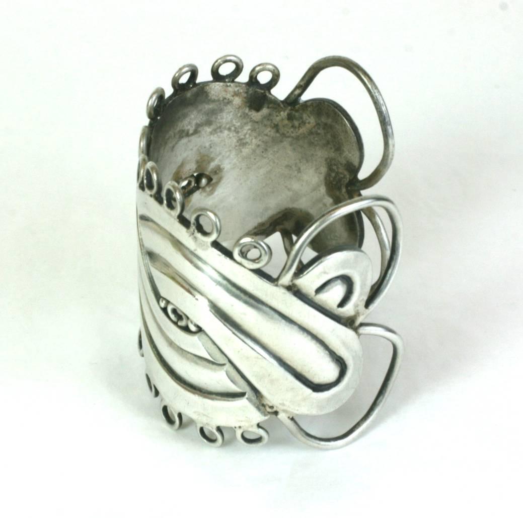 Early William Spratling Mask Cuff in heavy gauge high grade sterling silver, circa 1940's.
Early markings in Excellent condition. 1940's Taxco, Mexico. 
Width 2.25