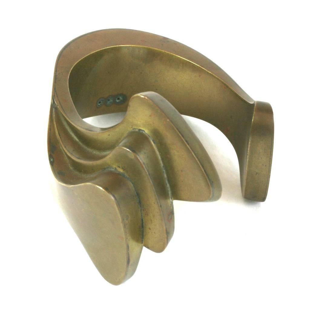 Wonderful and amazing Biomorphic Artisan Cuff, handmade in brass by a talented jeweler in the 1950's. 
This wonderful unsigned cuff was undoubtledly created by a very fine studio jeweler. The quality is extraordinary and the amazing design falls