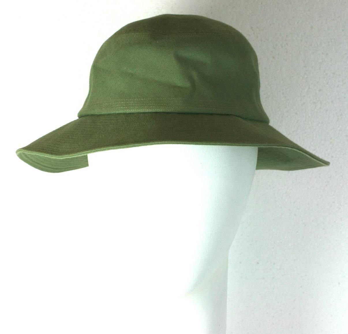  Yves Saint Laurent green cotton twill Fisherman's Hat with topstitched detailing throughout brim. A gallic interpretation where the brim is slightly wider in back as the original style would be. 
A. Elbaz for YSL. 2000's France. Excellent