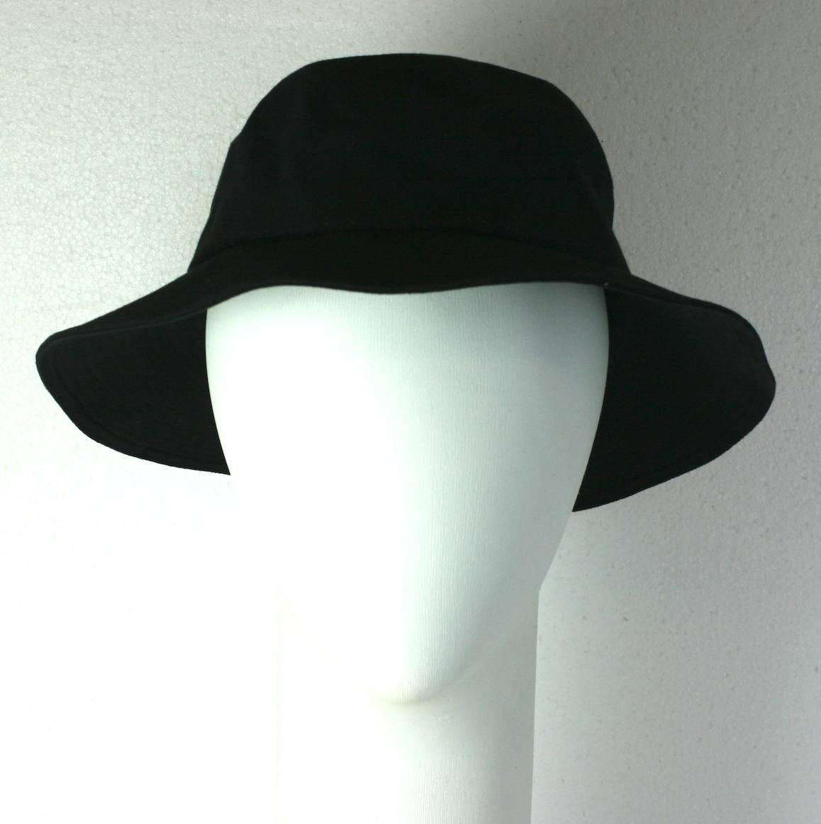 Yves Saint Laurent black cotton twill Fisherman's Hat with topstitched detailing throughout brim. A Gallic interpretation where the brim is slightly wider in back as the original style would be.
Alber Elbaz for YSL. 2000's France. 
Excellent