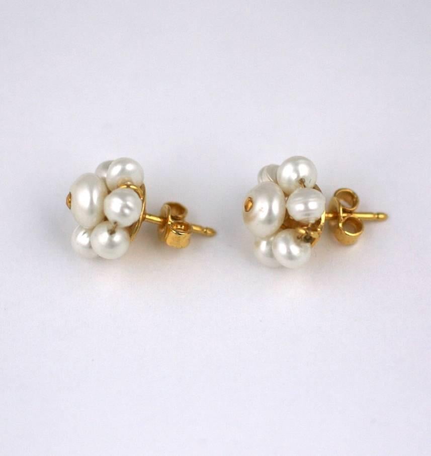 Tiniest Chanel pierced classic pearl and gilt stud earring with pearls made by Maison Gripoix. Signed Chanel, Excellent Condition. 1990's France. 
.50