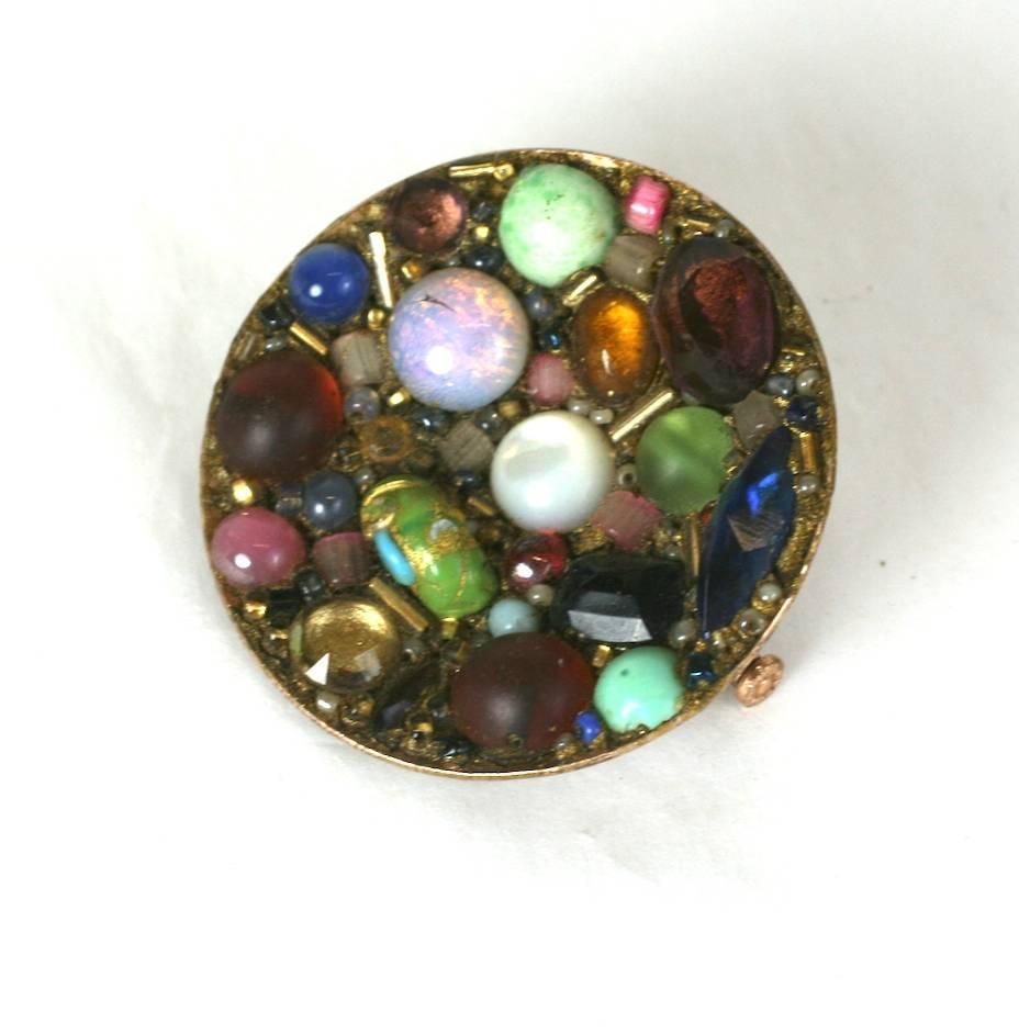  Emilio Terry Artisan Collage Brooch of varied crystals and pate de verre cabochons and glass seed beads. Made in France. Unsigned. 1930's France.
Excellent condition.
 1.50"
In the 1930s, Jean Michel Franck was surrounded by other artists