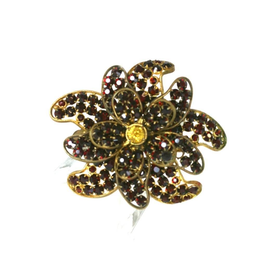 Czechoslovakian faux garnet and citrine camellia layered clip brooch. Hand set in gilt metal in 3 tiers.  Made in Czechoslovakia, circa 1930's. Excellent Condition
Width 2.75