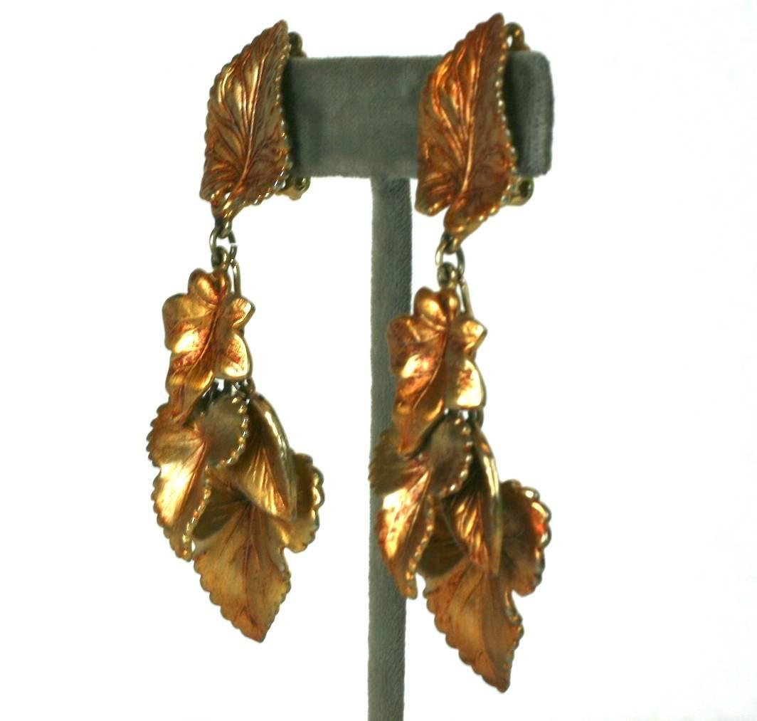 Schiaparelli's lovely multi leaf gilt cluster dangle ear clips in original antiqued patinated finish. Clip back fittings. Excellent Condition, signed with script signature.
Length 3.50, Width 1