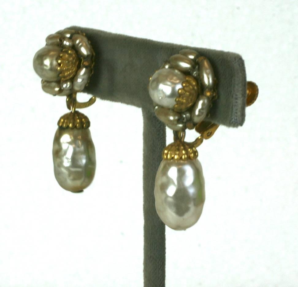 Miriam Haskell signature Russian Gilt filigree drop earrings, set with classic hand made faux round, oval and rice pearls. Clip back fittings. 1940's USA.
Excellent Condition.
Length 1.50