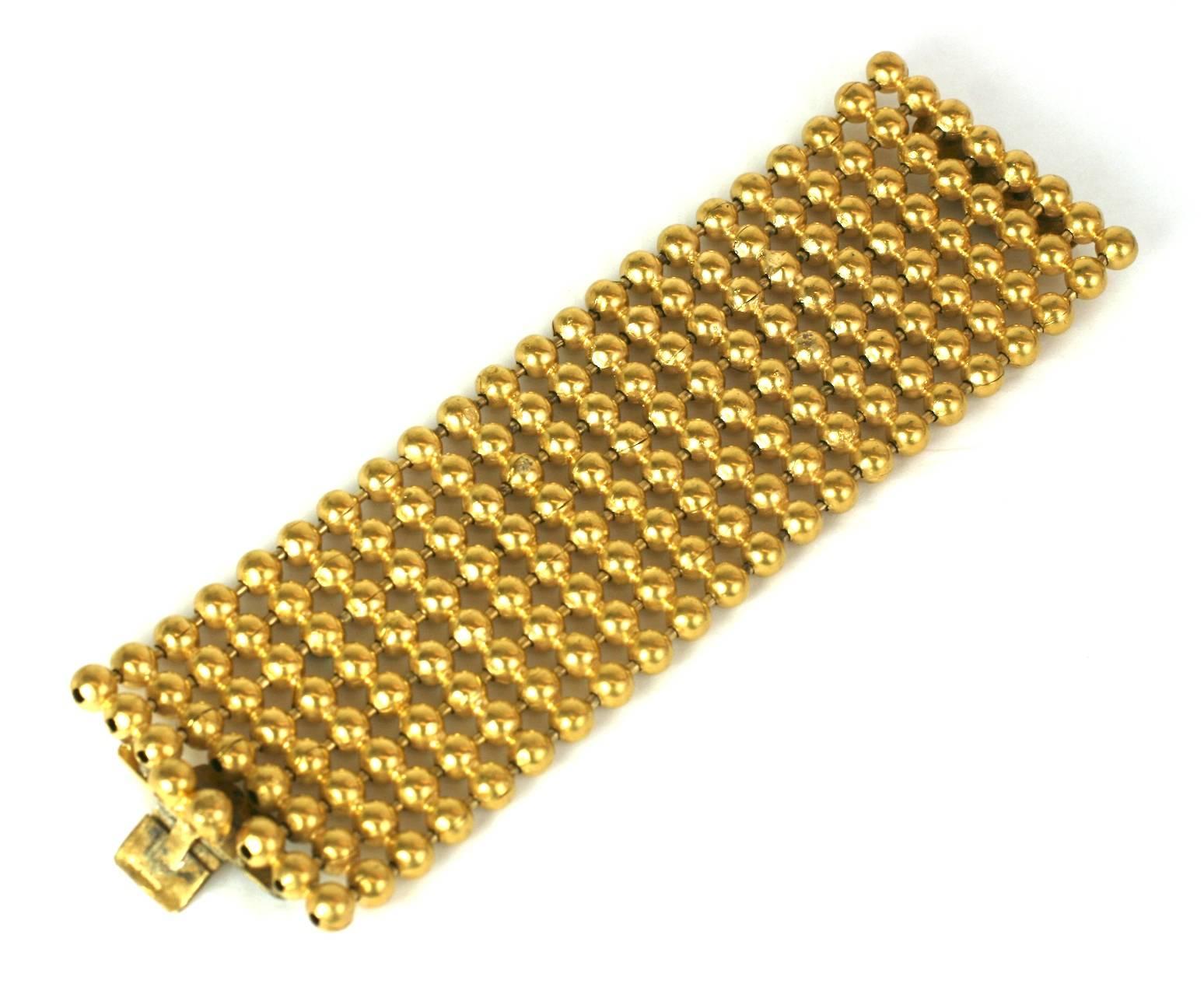 Striking French bright gilt ball chain wide cuff bracelet. Marked France.
Excellent Condition. 1980's France. 
Length 7 3/8