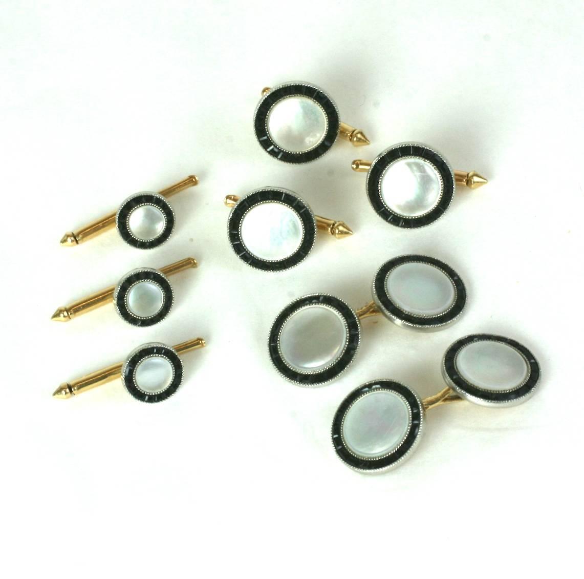 Elegant Art Deco Mother of Pearl and Calibre Onyx Stud Set set in 14k gold. Very lovely quality manufacture with outer rings of onyx which have been 