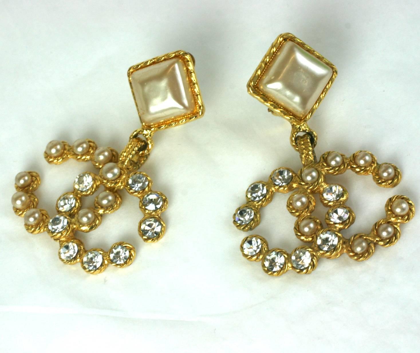 Chanel Pearl and Pave Logo Drop Earrings by Maison Gripoix. Large handmade cushion shaped faux pearls are set on the ears with an entwined 
