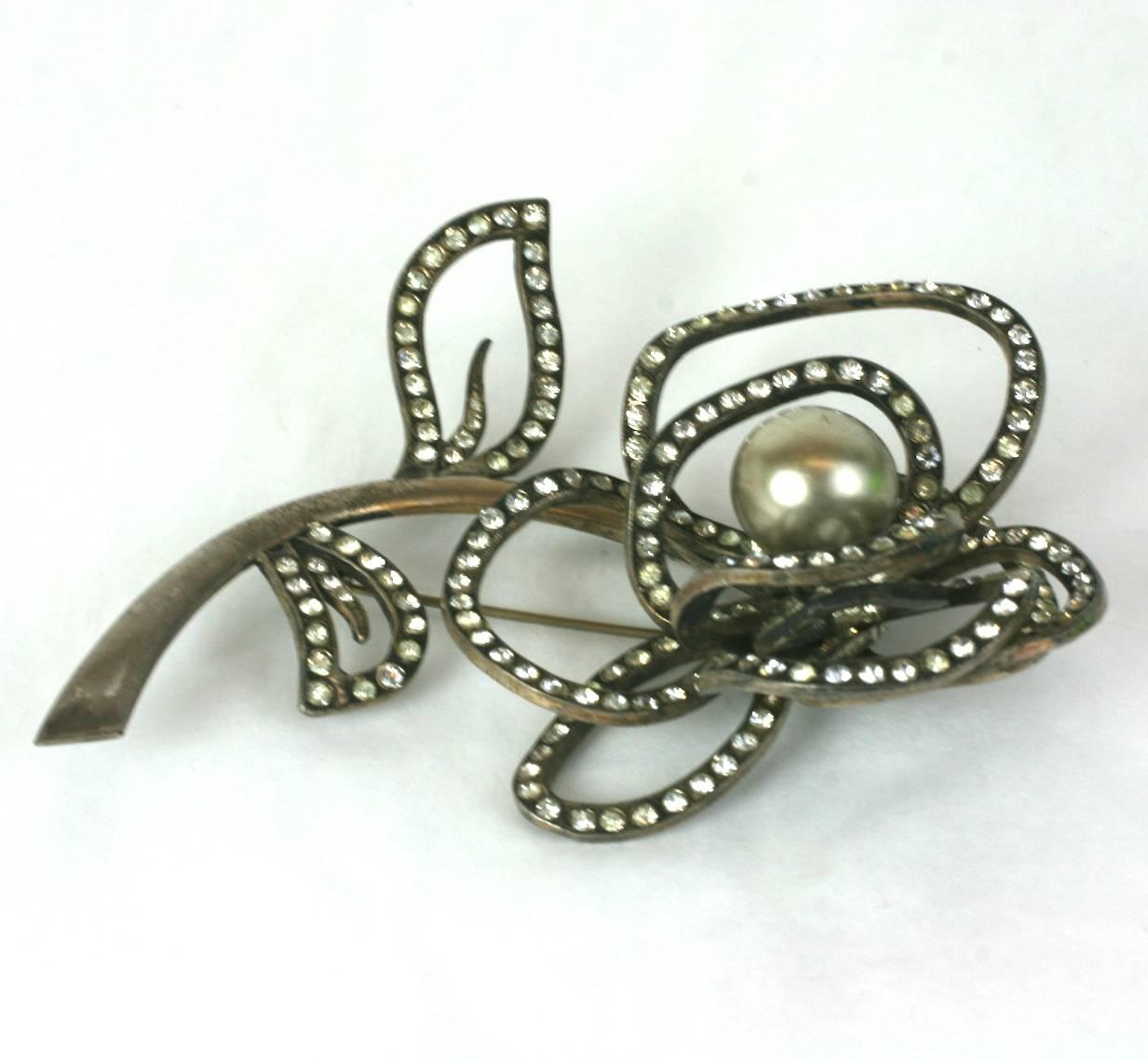 Massive,Roger Jean Pierre dimensional French abstract rose brooch of silver gilt metal, hand set crystal pave and focal faux silvered pearl. 1950's France. Excellent Condition. 
Marked Depose. 
4.50