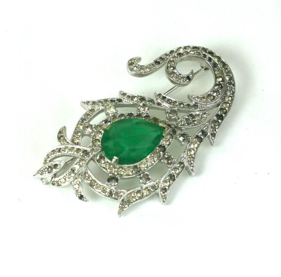 Polcini faux emerald pear shaped faceted stone brooch with crystal pave in the mughal style. 1950's USA. Excellent Condition.
Length 2.75