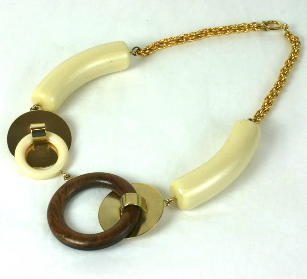 French modernist artistic vari link necklace composed of gilt discs, faux wood  and bakelite rings with large faux ivory bakelite toggle stations .
Marked France. Excellent Condition.
Length 18.50
