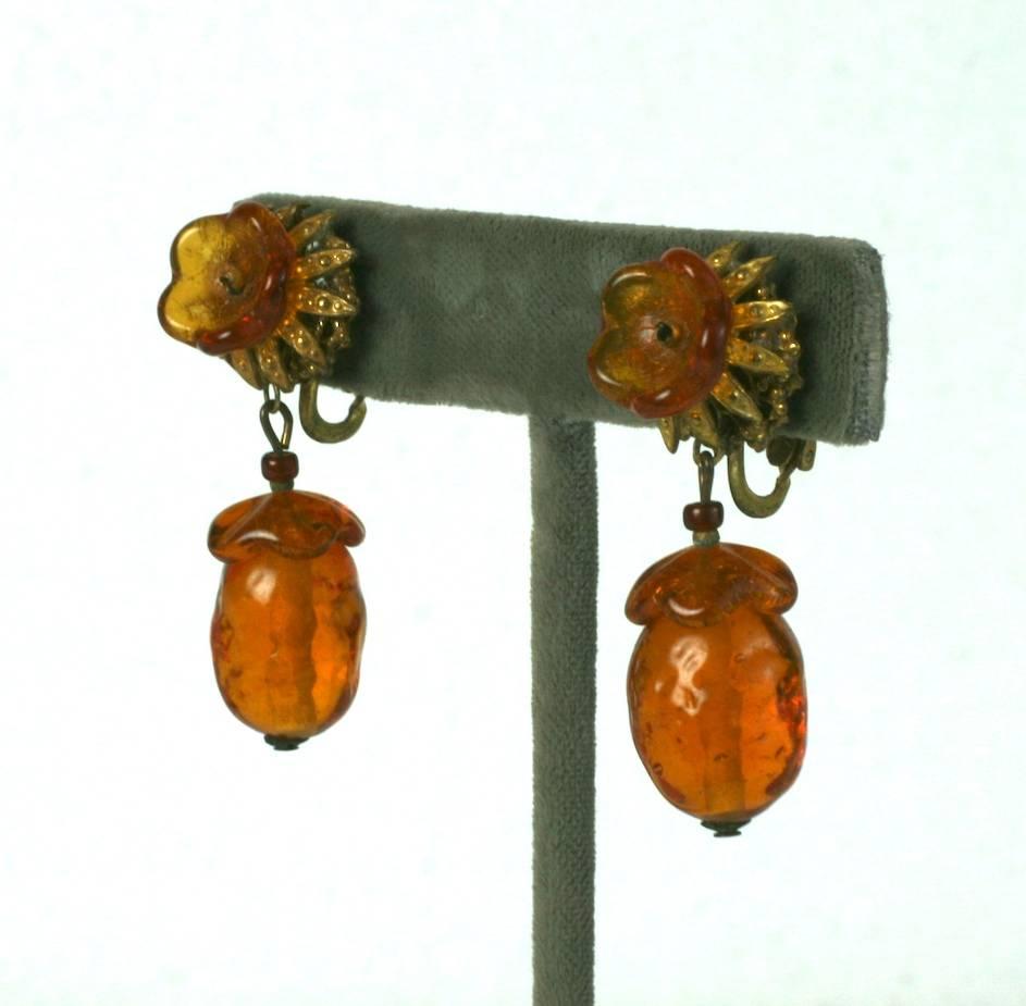 Miriam Haskell topaz pate de verre acorn drop earclips set in signature Russian gilt metal with hand made glass flower heads. Adjustable clip back fittings.
Excellent Condition. 1940's USA. 
Length 1.75