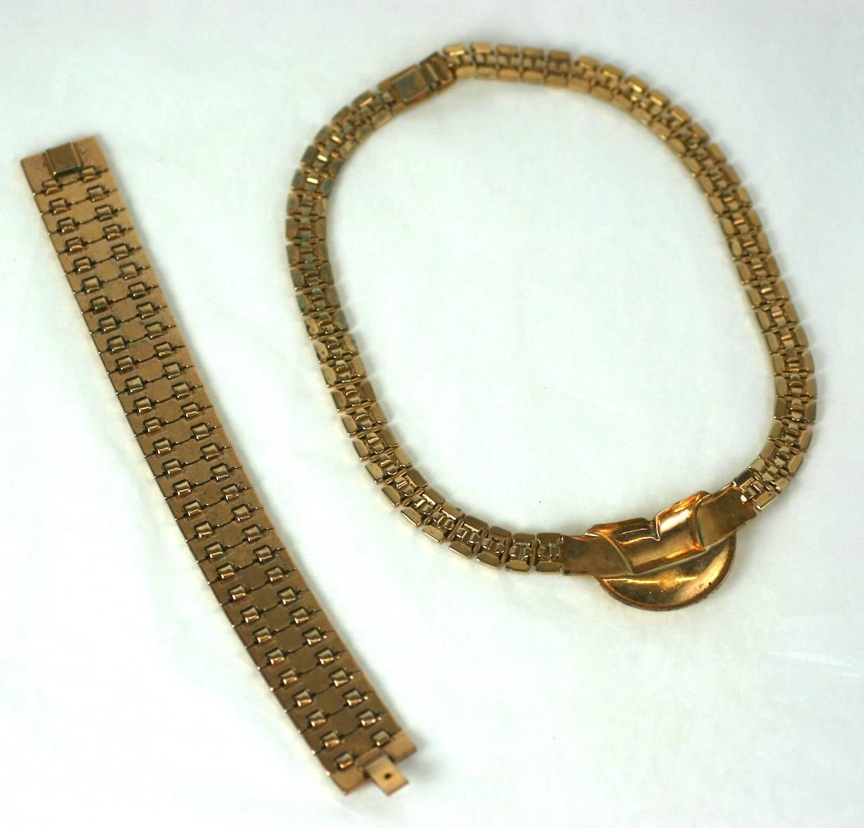 Attractive Trifari gilt suite with Retro link necklace and bracelet in the style of Van Cleef, from the 1940's USA. Excellent Condition.
Length 15.50